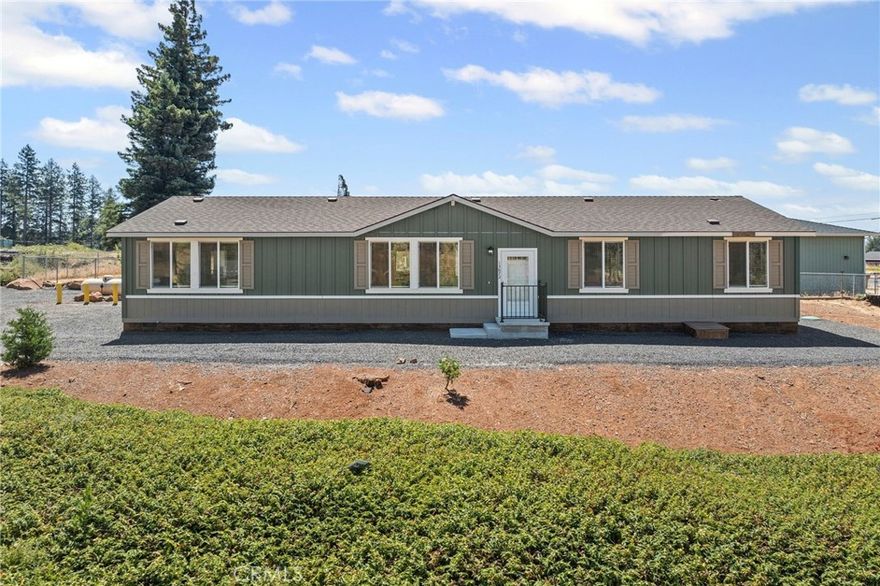 Discover comfort and style in this new manufactured home located on a desirable corner lot in lower Magalia. This 3-bedroom, 2-bathroom home features an open floor plan that seamlessly blends living, dining and kitchen areas- perfect for entertaining or relaxing with family..  Enjoy the added space of a large bonus room, ideal for an additional living space, game room or home office. Each bedroom includes a walk-in closet for premium storage as well a bonus storage room in the hallway. This turnkey home also features stainless appliances and a large island in the kitchen, a separate laundry room; and a primary bath with separate tub and shower. 

Whether you are looking for your first home, a family upgrade, or a quiet place to retire, this home offers comfort, value and room to grow. Don't miss out- Schedule your showing today!
