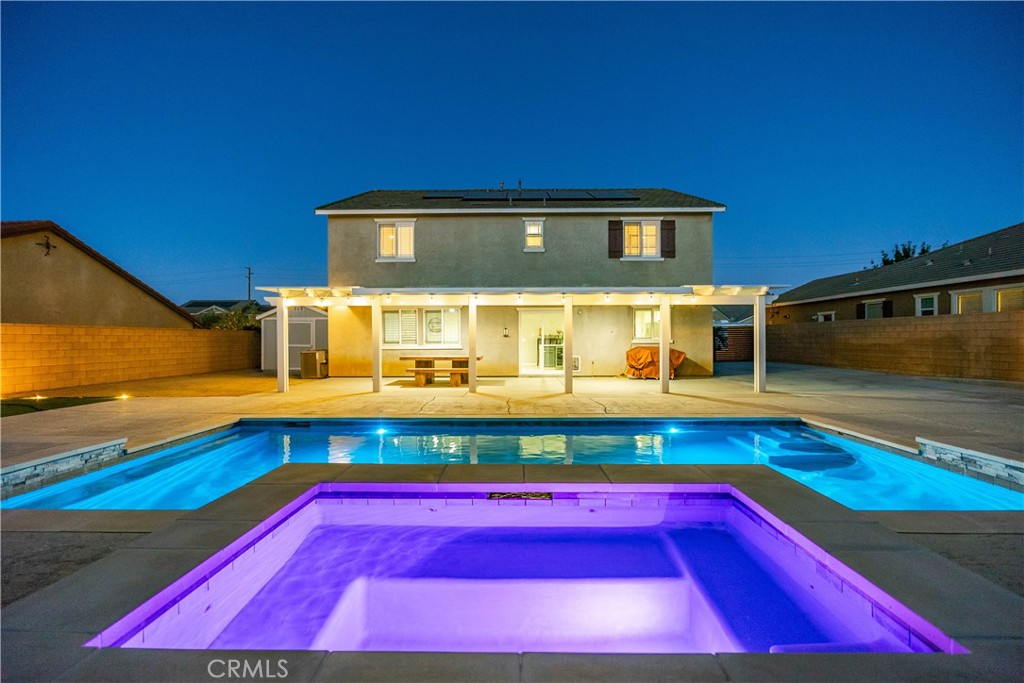 Stunning home built in 2011, located in a highly desirable neighborhood, offers the perfect blend of style, comfort, and upgrades! Step into the gorgeous chef's kitchen featuring granite countertops, a large center island perfect for entertaining, upgraded appliances, wine fridge, walk-in pantry, and a large farm sink. The kitchen opens directly to the spacious family room, creating a warm and inviting atmosphere. Elegant crown molding, plantation shutters, and tile flooring downstairs elevate the interior design.
This ideal floor plan offers a total of 5 bedrooms and 3 bathrooms, including a convenient downstairs bedroom and full bath. Upstairs, you'll find 4 additional bedrooms, a large loft, and a laundry room for ease and comfort.
The backyard is an entertainer's dream with a custom designer pool featuring color-changing lights, a recently upgraded patio cover, a Tuff shed on a concrete slab, and a putting green for fun year-round. The front yard boasts water-efficient landscaping, while the oversized RV access with cement pad provides plenty of space for your toys.
Additional highlights include: paid-off solar panels, water softener and whole-house water filtration system, tankless water heater, new flooring, and an electric car charger in the garage.
Pride of ownership shines throughout this beautiful home and neighborhood—truly a must-see!