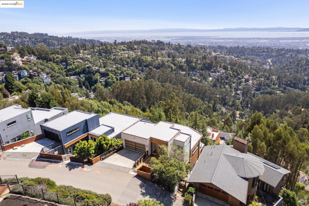 Perched in the prestigious Montclair Hills, 25 Diablo Drive redefines modern luxury with clean architectural lines, open interiors, and panoramic vistas. From this exclusive vantage point, take in five bridge views that showcase the Bay Area in all its glory—spanning from the North Bay to the San Mateo & Dumbarton Bridges, including all of downtown San Francisco and its glorious Bay and Golden Gate Bridges. Inside, the home boasts a gourmet kitchen designed for both serious chefs and effortless entertaining, seamlessly connecting to expansive living spaces. The lavish primary suite offers unmatched privacy, spa-like comforts, and breathtaking views, creating the perfect retreat. Whether hosting an intimate dinner or a grand gathering, this home offers ample space for entertaining, blending indoor and outdoor living with ease. Uniquely positioned, 25 Diablo Drive provides easy access to both San Francisco and Walnut Creek, making it an ideal location for those who value convenience without sacrificing serenity. Separate guest suite with its own access. A 3-stop elevator for convenience and an opulent wine storage area. This is not just a home—it’s a lifestyle statement, a rare combination of design, views, and accessibility. Views: Downtown, Ridge