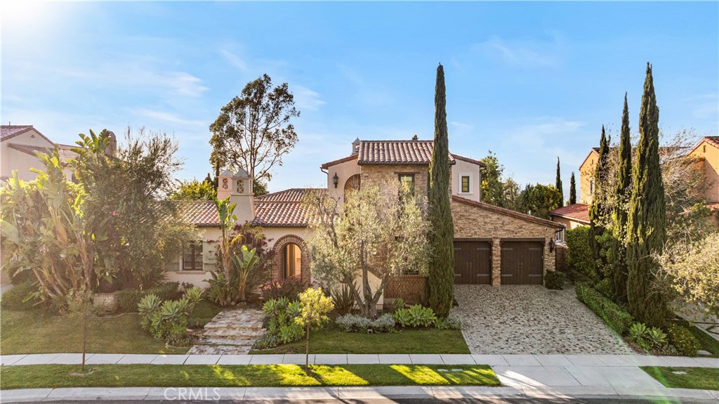 Perched at one of the highest elevations in Irvine’s prestigious guard-gated community of Summit at Turtle Ridge, this exceptional 5,639 sq ft luxury estate offers unobstructed panoramic views of the ocean, Catalina Island, surrounding mountains, and city lights. Situated on a private, single-loaded street, the home welcomes you with a romantic breezeway and a grand courtyard featuring an outdoor fireplace. Inside, an open-concept layout showcases soaring vaulted ceilings, a main-floor primary suite, and a gourmet kitchen with an oversized island, perfect for entertaining. A private second-floor guest quarters with a separate entrance and kitchenette offers ideal accommodations for visitors or multi-generational living. The beautifully designed backyard includes a built-in BBQ, tranquil water feature, and space ready for a custom pool. No expense was spared on upgrades, which include a 10-camera security system, 78-point alarm system, whole-house audio, Control4 automated lighting, solar panels, custom closets, a home theater, hand-selected stone, and luxury designer finishes throughout. Residents enjoy resort-style community amenities and convenient access to top private schools, UC Irvine, and award-winning public schools such as University High and Vista Verde.