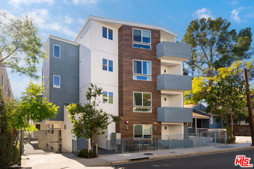 Welcome to 11912 Laurelwood Dr, a modern, two-story townhouse-style condo that blends comfort, style, and an unbeatable location in the heart of Studio City. As you enter, you'll immediately notice the thoughtful layout featuring high ceilings and an open-concept Kitchen/Dining/Living space, with a large powder room on the main level - perfect for entertaining and gathering. Also located conveniently on the first level is the spacious primary suite, complete with a generously sized walk-in closet and ensuite bathroom featuring a luxurious soaking tub. Upstairs, you will find two additional bedrooms and a bathroom, perfect for guests or a home office setup. With a community rooftop deck that offers panoramic views of the Hollywood Hills stretching to the mountains, and designated off-street parking for the unit and guests alike, it's the perfect place to enjoy a quiet morning or host friends for a sunset celebration. This modern building is ideally located South of the Boulevard, adjacent to some of Studio City's favorite spots. Whether grabbing groceries at Trader Joe's, enjoying your morning latte at Blue Bottle Coffee, or browsing the local boutiques, everything you need is right around the corner.