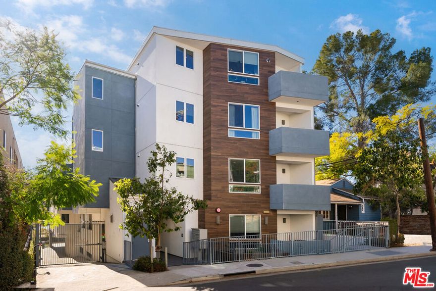 Welcome to 11912 Laurelwood Dr, a modern, two-story townhouse-style condo that blends comfort, style, and an unbeatable location in the heart of Studio City. As you enter, you'll immediately notice the thoughtful layout featuring high ceilings and an open-concept Kitchen/Dining/Living space, with a large powder room on the main level - perfect for entertaining and gathering. Also located conveniently on the first level is the spacious primary suite, complete with a generously sized walk-in closet and ensuite bathroom featuring a luxurious soaking tub. Upstairs, you will find two additional bedrooms and a bathroom, perfect for guests or a home office setup. With a community rooftop deck that offers panoramic views of the Hollywood Hills stretching to the mountains, and designated off-street parking for the unit and guests alike, it's the perfect place to enjoy a quiet morning or host friends for a sunset celebration. This modern building is ideally located South of the Boulevard, adjacent to some of Studio City's favorite spots. Whether grabbing groceries at Trader Joe's, enjoying your morning latte at Blue Bottle Coffee, or browsing the local boutiques, everything you need is right around the corner.