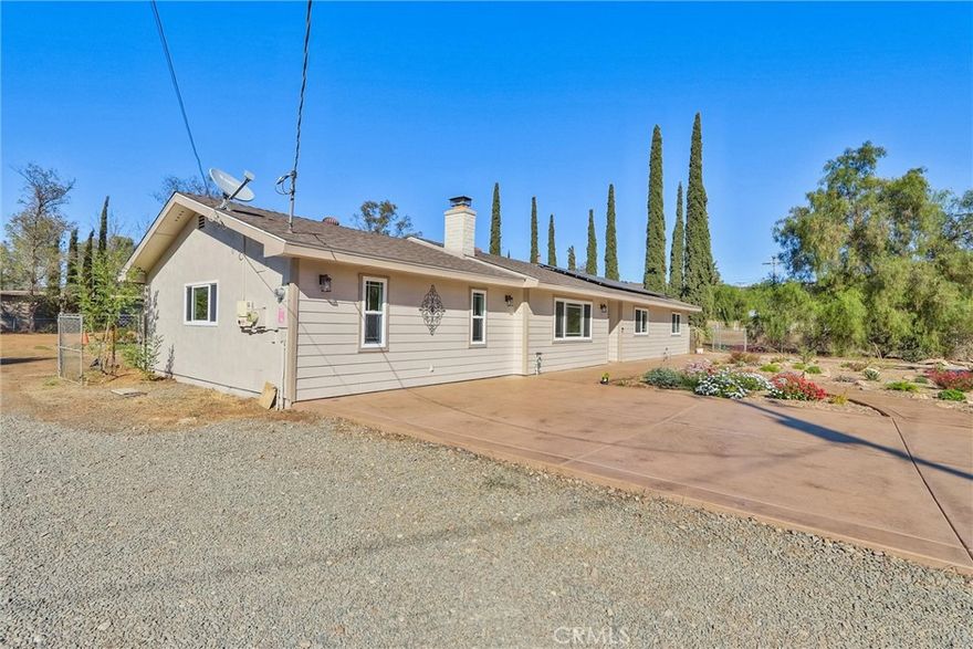 Welcome to this beautifully remodeled home in Ramona, where no expense was spared. Freshly painted inside and out using Sherwin Williams paint,  this residence features new ceiling fans, CAT5 cabling for all your networking needs, and new LED recessed lighting. Enjoy a surround sound system with ceiling speakers, solid surface counters and window sills, and a luxurious marble master bath with heated flooring and three shower heads. The hallway bathroom has also been tastefully updated.



The garage has been professionally converted into a family and media room, complete with a recessed floor outlet and stunning colored, polished flooring. The kitchen is equipped with stainless steel appliances, a ceramic cooktop, a new stainless steel vented hood, a moveable kitchen island, and a charming garden window. The updated laundry and utility room is plumbed for a sink, adding extra convenience.



Step outside to an expansive fully fenced backyard featuring a metal shed, a 10x14 foot slab ready for a shop/or shed, a covered patio with misters, stamped concrete, and a propane firepit—ideal for entertaining. The yard also has two drive through 12 foot gates. The front of the home boasts a large 6-inch steel-reinforced, colored, and stamped concrete driveway with sidewalks and newly installed waterwise landscaping. Additional highlights include a newer roof with transferable warranty, paid solar, RV parking with a 50 Amp panel, an owned propane tank, a backyard sprinkler system, as well as front and backyard drip irrigation all on timers. There is a view of the hills from the front of the home, and the location could not be more ideal as it is located on a private quiet road.