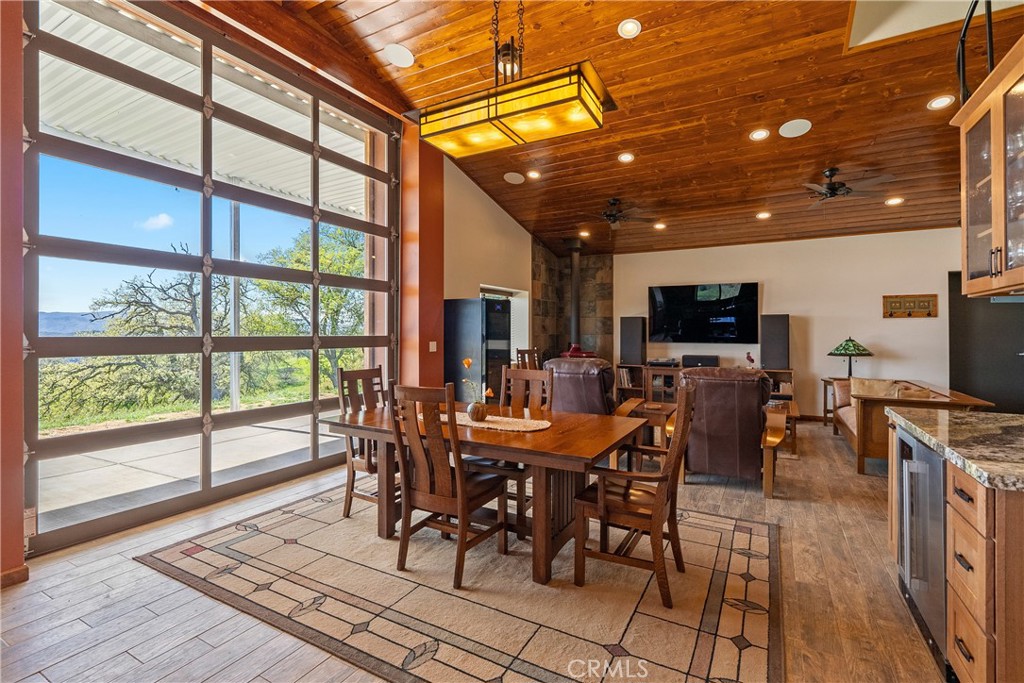 Tucked away in awe-inspiring hills that back to 800+ acres of County-owned land, this 90+/- acre property offers sweeping views of scenic Santa Margarita Lake. This is a rare opportunity to own a slice of paradise that’s just minutes from town yet far enough to offer complete tranquility and a true escape from city life. Whether you're drawn to living in the thriving greater Paso Robles area wine country, looking to start a farming venture, raise livestock, or simply indulge in outdoor recreation, the possibilities here are endless. Built in 2021, the 2-bedroom, 2-bath home blends warmth and elegance with thoughtful features, such as refined granite countertops, wooden floors, 5-burner stove, claw foot tub, and attached 2-car garage. Solar panels are owned outright, reducing energy costs and offering sustainability. The connected PG&E electricity runs underground with no obstructing power poles. There is a permitted 1,620 sq. ft. commercial building/workshop, ideal for a variety of uses. With office space, two bathrooms, insulation, two heat pumps, fire sprinklers, and a dedicated 12,000-gallon water tank, the facility is a dream come true for artists, craftspeople, and viticulturists alike. The newly constructed 2,000 sq. ft. metal barn building, permitted as an Ag-Exempt building, offers versatile space with potential for a variety of uses and activities. Equipped with underground PG&E electricity, septic, domestic water, high-speed internet, and spectacular views of the lake framed by the glass-paneled roll-up doors opening to a covered patio, this adaptable building is perfect for enjoying the surrounding beauty. Just beyond your doorstep lies Santa Margarita Lake Recreation & Natural Area, a County park with many opportunities for activities, including camping, fishing, boating, hiking, biking, and horseback riding. The nearby town of Santa Margarita offers charming local attractions like celebrated restaurants, wine tasting, and an adventure park. San Luis Obispo is a short drive away with its wide range of services, job opportunities, hospitals, university, and cultural amenities. With breathtaking natural surroundings, this setting invites you to live, work, relax, and enjoy everything this picturesque and desirable region has to offer.