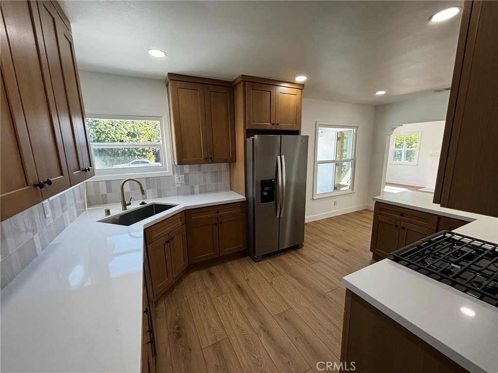 New kitchen, new kitchen appliances, new flooring, new bathrooms , new windows , new driveway , new garage door, new AC system. Detached garage perfect for a garage conversion - you can add more living space. Welcome to 2021 N Hicks Ave, a beautifully renovated home nestled in the sought-after Hillside Village neighborhood of Los Angeles. Just a short walk to the USC Health Sciences Campus, this move-in-ready property combines modern finishes with classic charm.
Step inside to a bright open living area featuring recessed lighting, a sleek fireplace, and new wide-plank flooring throughout. The brand-new kitchen offers quartz countertops, warm shaker cabinets, stylish tile backsplash, and stainless steel appliances. The updated bathroom boasts a contemporary vanity, matte black fixtures, and a clean modern design. Spacious bedrooms are filled with natural light, and the home’s efficient layout makes excellent use of every square foot.
Outside, enjoy a private yard perfect for relaxing or entertaining. With its prime location close to Downtown LA, freeways, and local dining, this home is ideal for students, medical professionals, or anyone seeking a convenient urban lifestyle near the USC medical campus.