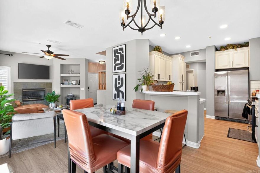 VA Assumable loan at 3.5%. Currently being rented as a 31 day airbnb rental averaging $6500/month. Discover comfort, style, and privacy in this beautifully updated end-unit townhome nestled within the serene Old Schoolhouse gated community. Step inside to a bright, open floor plan where the fully remodeled kitchen and dining area flow seamlessly into the inviting living room, featuring a charming rock fireplace and plantation shutters. Just beyond, a private patio with full concrete surfacing offers the perfect spot for morning coffee or evening relaxation. Downstairs, you’ll also find a versatile bedroom ideal for guests or a home office, a convenient half bath, and a dedicated laundry room. Upstairs, the spacious primary suite provides a peaceful retreat with its ensuite bathroom and walk-in closet, while two additional bedrooms and a cozy niche create the perfect work-from-home setup or study space.The home also offers an attached two car garage. With new vinyl flooring and carpet installed within the past year, this home is truly move-in ready. The community offers a tranquil setting with a sparkling pool and spa—all just five minutes from shopping, top-rated schools, and freeway access.