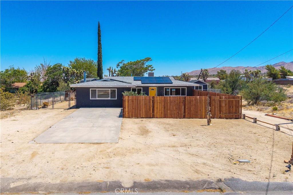 SELLER OFFERING $10,000 TOWARDS BUYERS CLOSING COST WITH FULL PRICE OFFER!! AFFORDABLE 4 BEDROOM, 2 BATH (WITH POTENTIAL 5TH BEDROOM), POOL, SHE SHED, SOLAR & MORE! If you’ve been looking for a larger home with lots of bedrooms and upgrades at an affordable price—this is the one! Starting from the outside, the home is already connected to the sewer system and offers ample parking with two long driveways, one of which includes a large concrete pad and direct access to the backyard. As you approach the front door, you’ll love the private courtyard, complete with concrete patio space and a raised deck, making it perfect for relaxing or entertaining outdoors. Inside, the entire interior has been freshly painted. The living room is spacious and bright, with a large window overlooking the courtyard. The dining room has plenty of room for gatherings and features French doors that open to one of two covered patios. The kitchen is generous in size with plenty of counter space, and includes a walk-in pantry just off the interior laundry room. The guest bathroom has been completely remodeled with stylish subway tile and a large walk-in shower. The primary bedroom offers its own ensuite bathroom with a shower/tub combo. In addition to the three other bedrooms, the converted garage includes a closet and can serve as a 5th bedroom, office, or flex space depending on your needs. The backyard is fully fenced and features: Two covered patios—one with a paver seating area near the above-ground pool. The other patio is perfectly shaded most of the day and leads to the fully finished SHE SHED, which includes window A/C and a space heater, making it ideal for hobbies or a personal retreat. Additional upgrades include: Dual-pane windows throughout, Newer HVAC system, Newer electrical panel, All water supply lines recently replaced, Leased solar system designed to support both the home and an electric vehicle. Homes with this much space and value do not last long—call now to schedule your private showing before it's gone!