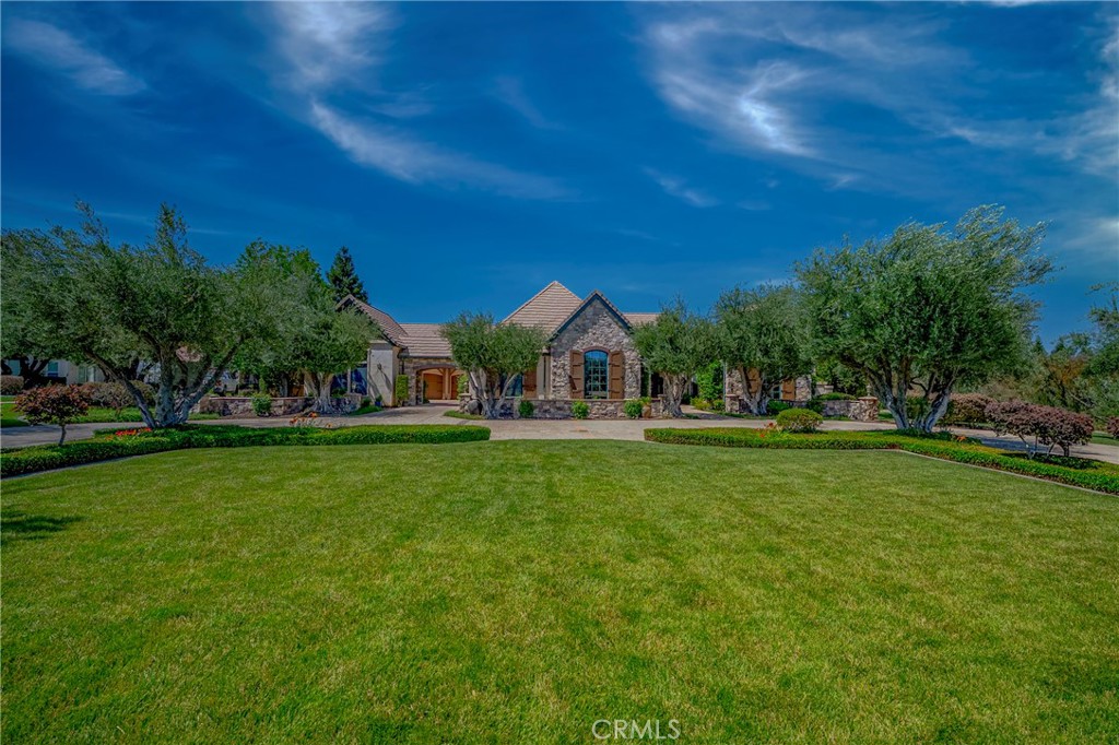 2882 Trovare Ct, Merced – Luxury Living in a Prime Gated Community
Welcome to 2882 Trovare Court—an extraordinary 4-bedroom + study, 5-bathroom estate offering 4,171 square feet of luxurious living space on a full acre in one of Merced’s most desirable gated communities.
Perfectly situated near UC Merced and Mercy Hospital, this property offers the rare combination of country serenity with in-town convenience.
Inside, this custom-crafted home is filled with intricate architectural details and premium finishes. The chef’s kitchen is a showstopper, featuring Taj Mahal quartzite countertops, a built-in Subzero refrigerator, Thermador 6-burner gas range, built-in microwave, and elegant hardwood flooring throughout the main living areas.
The formal living room, separate family room, and dining room offer ideal spaces for entertaining and daily living. The luxurious primary suite is a private retreat, boasting its own fireplace, a spa-like bath with heated floors, a large circular walk-in shower, and a jetted soaking tub.
Outside, the backyard is a true oasis with a resort-style swimming pool featuring a slide and waterfall—perfect for summer fun and entertaining.
Additional highlights include a spacious 4-car garage, with the fourth bay already plumbed for an accessory dwelling unit or in-law quarters, and a 1,000-gallon underground propane tank for efficiency and energy reliability.
Don’t miss this rare opportunity to own a beautifully designed, amenity-rich home in an exclusive location.