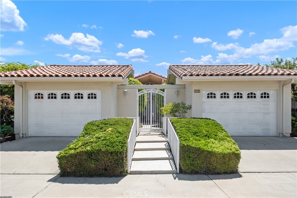 CHARMING SINGLE-LEVEL HOME ON CORNER LOT JUST LISTED IN UNIVERSITY PARK! This 1,592 sqft Chancellor home offers a 2 bed+den, 2 bath floorpan with quality updates throughout. Features include dual-pane windows & doors, beamed & vaulted ceilings, spacious living/dining area with lots of natural light, cozy dual-side gas fireplace, and a fully upgraded kitchen with custom cabinetry, pass-through to dining area, quartz countertops & backsplash, stainless steel appliances, luxury vinyl flooring, and added recessed lighting. There are two big bedrooms at either side of the home, both featuring brand new carpeting, a full-wall of closets and sliding glass door access to the courtyard deck areas. The master bedroom includes an en-suite bath with updated quartz countertop vanity, step-in shower and private toilet room. The guest bathroom sits just outside the second bedroom and offers a similar updated vanity with lots of counter space & shower-in-tub. There is also a den/office area that can easily be converted to a third bedroom, as well as a central bar area for entertaining. Out back you will find a relaxing patio area, large planter for gardening, and full-length grassy area on the side of the home. Other features include inside full-size laundry room, central HVAC, Spanish clay tile roofing, and two separate single-car garages with motorized roll-up garage doors. Quiet inside-tract location on cul-de-sac street, close to parks & shopping, and a low tax rate. All termite and roof repairs just completed with full warranty - this one is ready to go!