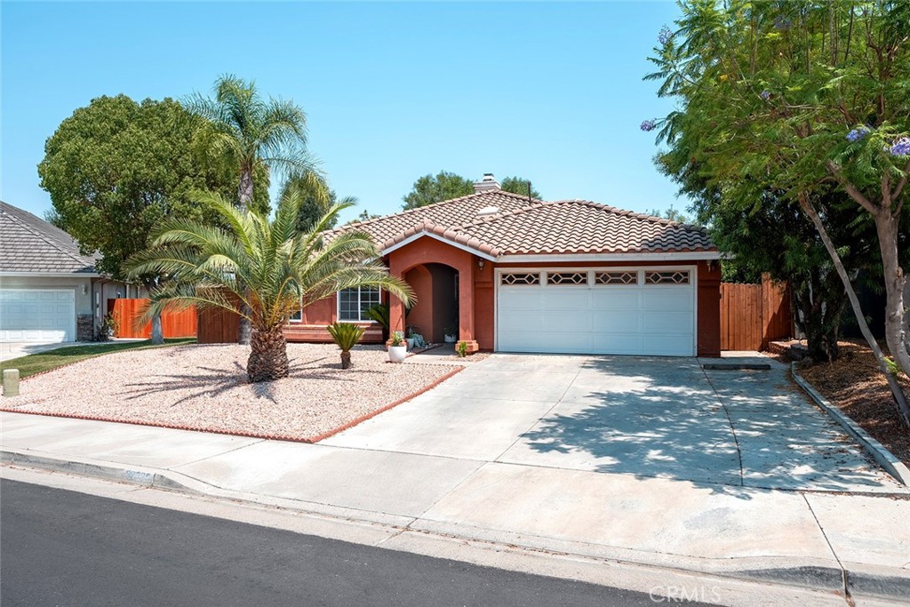 Welcome to this lovely single-story home featuring 3 bedrooms and 2 baths, a two-car attached garage, and an amazing backyard with no rear neighbors and beautiful mountain views. This home is perfect for first-time buyers or those looking to downsize while still enjoying ample space. Inside, you'll find high ceilings, tile flooring throughout the main living areas, wood flooring in the bedrooms, and a cozy fireplace in the living room...oh and a tankless water heater. The updated kitchen offers granite countertops and an undermount sink, and it opens up to the living room, creating a great flow for entertaining. Outside, the low-maintenance front yard and lovely backyard offer mature trees for shade and a fantastic covered patio. This home is conveniently located near major shopping, schools, parks, the lake, and much more – truly embodying the spirit of "Dream Extreme Lake Elsinore!"