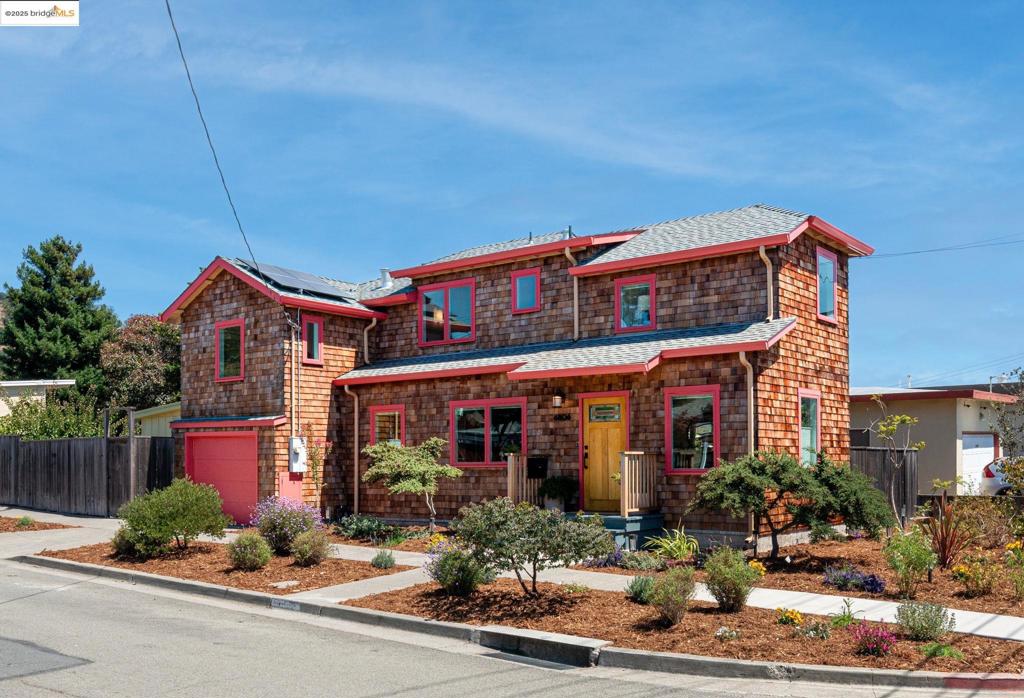 On a sunny corner lot, this El Cerrito home feels brand new—because it nearly is. Rebuilt down to the studs in 2018, it has newer foundation, framing, insulation, windows, roof, and almost every system replaced. Copper plumbing, updated electrical, owned solar, and a high-efficiency heat pump for both HVAC and hot water are rare finds in a market of older homes. From the street, you can’t miss the timeless shingled facade and cheerful trim. Inside, the home is just as joyful: modern, open, and designed for connection. The main level offers a spacious living/dining area and a kitchen made for both cooking and conversation. Upstairs are three bedrooms, two full baths, and a bright flex nook. Outside, enjoy a wraparound yard with mature fruit trees and plenty of play space, plus a detached studio makes an ideal office, gym, or creative workshop. Zoned for Madera Elementary and close to the Natural Hillside Area, Ohlone Greenway, public transit, and HWY 80, this location balances convenience with access to nature and community.