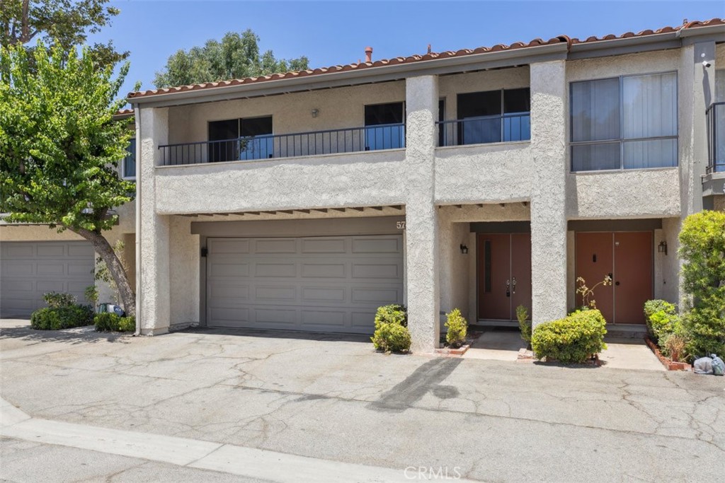 You have to see this beautifully upgraded three-bedroom townhome settled in the heart of Porter Ranch, less than a mile from premier shopping and dining! Upon entering, you will be wowed by the brand-new luxury vinyl plank flooring, all new kitchen appliances, freshly painted walls, some new fixtures, high ceilings, and the abundance of natural light. The kitchen has new quartz countertops, new cabinet pulls on all cabinetry, brand-new stainless-steel appliances, new kitchen sink and faucet, and a patio door opening to the spacious private rear patio. There is an eating area off the kitchen. The private rear patio is a perfect place to relax or dine al fresco. The light and bright main family room has high ceilings, a wet bar area, and an oversized patio door opening to the front facing balcony. The primary suite has a patio door opening to the front facing balcony and it also has an attached private bathroom with a new faucet and a walk-in shower stall. The other two rear-facing bedrooms share the hall bathroom, which has a shower/ tub combo and a new toilet. Smooth ceilings throughout. There is a two-car garage with direct access to the unit. The new electrical panel and the Washer/ gas dryer hookups are inside of the garage. This unit is located in the Park Northridge townhome community, which offers a community pool, spa and manicured common area landscaping. The desirable location places it within moments from the fabulous shopping, dining, Whole Foods, and AMC at the new Vineyards at Porter Ranch shopping center, the Porter Ranch Town Center, Limekiln Canyon Trail, freeway access, and of course top-rated schools.