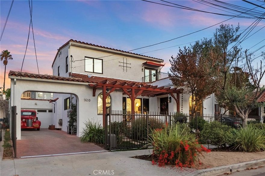 Welcome to this beautifully updated modern Spanish-style home in a central Los Angeles neighborhood with convenient access to Downtown, Hollywood, Beverly Hills, and Santa Monica. Behind a private gated entrance, you'll find a perfect blend of timeless character and contemporary upgrades. The open and inviting floor plan features sun-filled living spaces, elegant finishes, and white oak flooring throughout. With two spacious bedrooms upstairs, including a primary suite with a walk-in closet and extra storage, plus a convenient downstairs bedroom, the layout offers both privacy and flexibility, perfect for families, guests, or a home office. The home has been thoughtfully updated while honoring its Spanish charm, with arched details, sleek modern touches, designer upgrades, and a new HVAC system for year-round comfort. Smart features such as solar panels, fiber optic WiFi, heated towel rails in both bathrooms, and an ADT alarm system add efficiency, convenience, and peace of mind. A spacious detached garage, already equipped with a kitchenette, offers incredible potential as an ADU conversion (buyer to verify), ideal for rental income, a guest suite, or a creative workspace. Step outside and discover a private backyard retreat featuring the soothing sound of a "weeping wall" fountain, a charming covered patio with string lights, built-in seating, and a swing, creating a perfect setting for entertaining or relaxing. The yard also includes a grassy area, ideal for pets, play, or gardening. Situated in a highly desirable location near shopping, dining, and LA's most vibrant hotspots, this property is the perfect mix of style, comfort, and convenience. Public Record shows 2 bedrooms, 1 bathroom. The owner has added an additional bedroom and bathroom. Buyer to verify all permits and square footage.