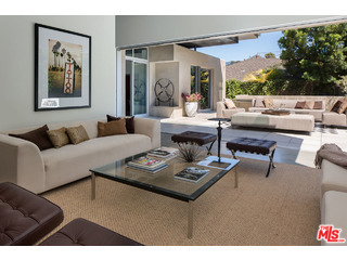 A custom designed architectural gem in highly desired North of Montana neighborhood, this is a work of art! The execution of refined design aesthetic include: floating wall sections, clerestory transom windows, exposed steel I beams, decorative wood paneled wall accents, floating open tread staircase, floor-to-ceiling pocket door systems, built in custom cabinetry, polished concrete floors and a minimalistic open floor plan. This home features over 7400 sq ft of meticulously designed indoor-outdoor living spaces inclusive of an outdoor living room, outdoor dining area, extended master suite private balcony, outdoor barbecue area situated on a huge private 8728 sq ft lot with grassy yard. Spread out on three levels allowing for varied use of spaces: inclusive of 5-6 bedroom suites; 7 bathrooms; a flexible use floor plan allowing for multiple home offices and private guest quarters. Ocean breezes abound, this is California indoor-outdoor living, at it's finest!