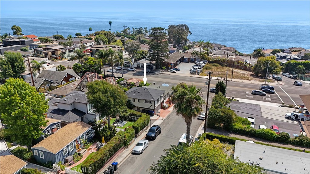 1290 N Coast Hwy, Laguna Beach Unit #C presents an exceptional opportunity to enjoy coastal living at its finest. This light-filled one-bedroom apartment captures stunning ocean views and embodies the vibrant, artistic charm of North Laguna. Just one block from the sand, the home invites you to start each day with beach walks and end it with unforgettable sunsets over Crescent Bay. Inside, the residence showcases a beautifully updated kitchen with stainless steel appliances, marble countertops, and a sleek glass tile backsplash. Soaring 12-foot ceilings with exposed beams enhance the open, airy feeling throughout the living room and bedroom. The remodeled bathroom features dual glass vessel sinks, elegant tile flooring, and a refined modern design. A small office nook with ocean views provides a serene space to work or unwind. The unit includes one designated parking space, access to free community laundry, and convenient street parking. Perfectly positioned in one of Laguna’s most desirable neighborhoods, this unfurnished apartment blends style, comfort, and the quintessential beach lifestyle.