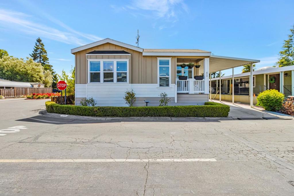 This stylish, upgraded manufactured home offers comfort, convenience & a classic layout perfect for families and busy professionals. From the welcoming foyer, enjoy polished features like crown molding, large windows, and coffered ceilings. The spacious living area with a cozy fireplace flows into a gourmet kitchen with quartz countertops, stainless steel appliances, tall beaded cabinetry, and a pantry, ideal for everyday meals or entertaining. A formal dining room with an elegant chandelier adds a touch of sophistication. Modern upgrades include high ceiling, crown molding, water-resistant laminate flooring, updated lighting fixtures & contemporary hardware throughout. A Solartube brightens the hallway between guest bedrooms, while the primary suite offers a peaceful retreat w/ dual walk-in closets & a luxurious bath featuring dual sinks, a soaking tub w/ quartz & mosaic tile, plus a tiled shower w/built-in niches. Located on a prime corner lot near guest & street parking, this home also includes a storage shed, A/C, gardening area, patio area & low-maintenance yard. Just minutes from major tech employers, transit & shopping centers. Plaza Del Rey offers family-friendly, resort-style living w/ three pools, fitness center, clubhouse & game rooms, perfect for work-life balance.