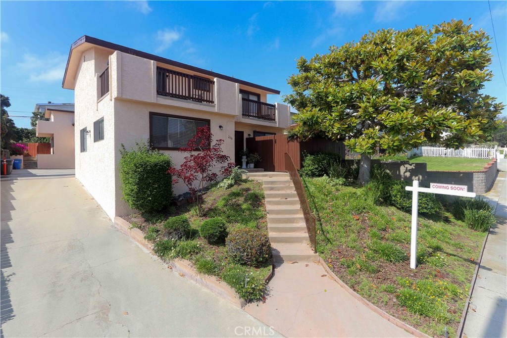 This updated 2-bedroom, 2-bath, end-unit townhome offers a combination of privacy, comfort, and convenience. Situated in a small, three-unit community with low HOA dues, the residence features an attached two-car garage and a private backyard complete with a deck and spa—ideal for enjoying indoor/outdoor entertaining or relaxing. Inside, upgrades enhance the living environment, starting with a luxury vinyl flooring and recessed lighting in the living areas, newer HVAC, ceiling fans in bedrooms, and fresh paint, The spacious living room includes a fireplace, the eat-in kitchen is well-equipped with all appliances, tile countertops, and opens directly to the backyard, deck, and spa. Upstairs are two generously sized bedrooms - the primary has a good-sized balcony with views of the treetops, the neighborhood, and far beyond. The updated second-floor bathroom offers a custom-tiled step-in shower with a built-in bench, custom lighting, and upgraded countertops. Additional features include a full-size laundry room and a convenient guest half-bath on the main level. With a newer roof, solar system, and spa motor (each approximately 2–3 years old), this home is both efficient and well-maintained. Located close to top-rated schools, transportation, shopping at the Galleria, entertainment, and the beach, it combines lifestyle and location in one attractive package. A must-see property!