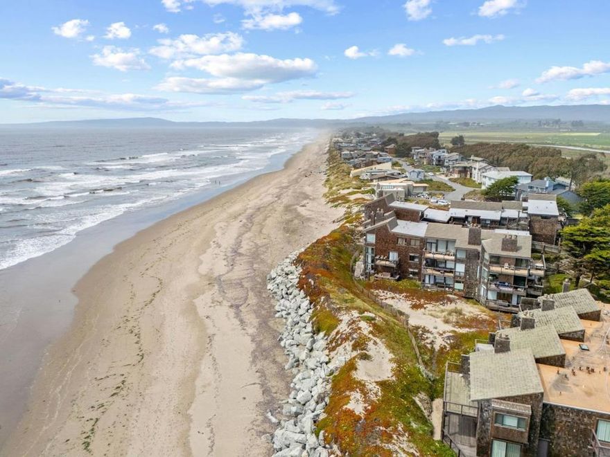 Experience the ultimate beachfront lifestyle at 3 Pelican Point, a beautifully renovated 3-bed, 2-bath (Airbnb ready with furniture included except a few accessories)  nestled in the exclusive Pajaro Dunes gated community. This first-floor unit boasts high-end finishes, including granite  countertops, marble accents, custom Shaker cabinetry, and SS appliances, all designed to elevate coastal living.  Expansive windows flood the open-concept interior with natural light, while a spacious deck offers seamless indoor  outdoor flow with direct access to the beachfront. Set between Santa Cruz and Monterey, this already successful vacation  rental provides resort-style amenities, including 24-hour security, scenic walking trails, and recreational courts, all  surrounded by lush dune preserves. Just steps from the sand, enjoy year-round ocean breezes, whale-watching, and  breathtaking sunsets, with world-class dining, golf, and entertainment a short drive away. Whether you're seeking a  primary residence, vacation getaway, or investment opportunity, this coastal sanctuary is a rare gem that perfectly blends  tranquility and adventure.