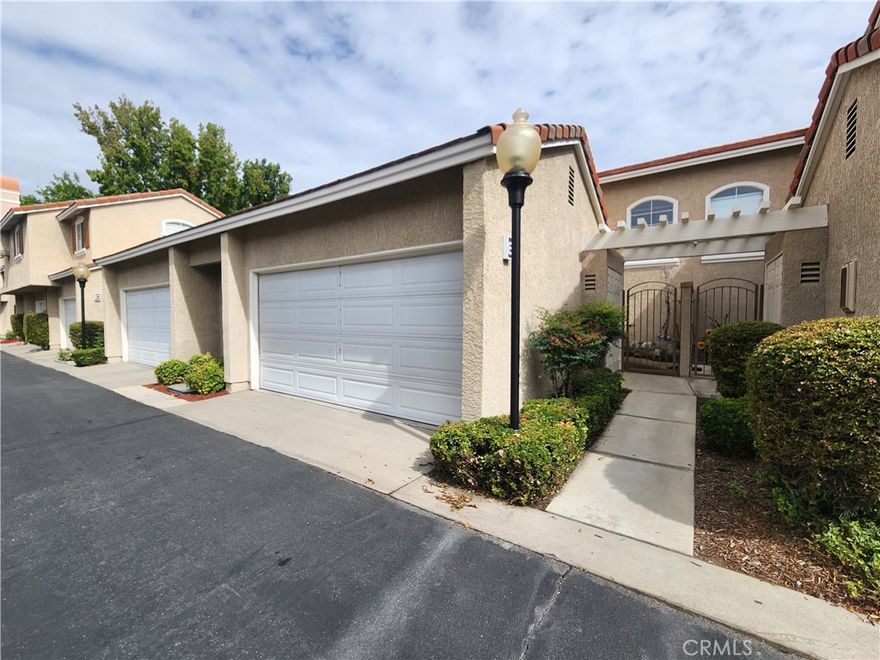 This 3-bedroom, 2.5-bathroom and 2 car attached garage Condo is now available. Wood flooring throughout. Kitchen has tile counter tops, a bar top area perfect for bar stool seating and includes stove-top/oven, microwave and dishwasher appliances. Living room features a decorative fireplace. Convenient half bathroom downstairs. The laundry room includes washer and dryer connections only. The primary bedroom has 2 closets and private bathroom with dual sinks. The other 2 bedrooms are very spacious and offer plenty of closet storage space. Community pool available. This property is located near the 210 freeway, Victoria Gardens, restaurants, grocery stores and many shopping plazas.