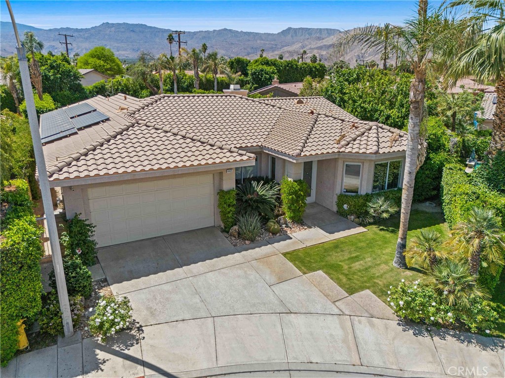 Available NOW through December 2025. Call for specific pricing based on your desired lease terms. Flexible lease terms are available! Presenting a turnkey, luxury vacation escape. Don't miss the opportunity to experience a fully furnished home in Palm Desert, situated at the end of a peaceful cul-de-sac in the prestigious and highly desired neighborhood of The Grove. Spanning 2,956 sqft., this stunning property features 4 spacious bedrooms and three and a half bathrooms. Upon entering, you'll be welcomed by a grand foyer with vaulted ceilings and elegant Crema Marfil Italian Marbel. The open-concept design leads into a spacious Marbel formal dining room and living room featuring breathtaking mountain views. The open kitchen is a chef's dream, equipped with stainless steel appliances, natural stone, and a large island offering the perfect space for entertaining throughout the year. The sleek, modern appeal is enhanced by upgraded “handleless” cabinets and granite counter tops. The kitchen seamlessly flows into the family room where you will find a cozy gas fireplace, perfect for those cool desert evenings while relaxing on the high-end Italian leather sofa overlooking the entire green belt with an outside water feature. Each bedroom is thoughtfully designed with easy access to the enclosed backyard, pool, and spa. The master suite has been fully remodeled boasting a large en-suite bathroom and luxury upgrades throughout. The oversized lot of over of 10,000 sqft. encompasses a Pebble Tech pool with water fall accents, a relaxing spa, and a beautiful garden with ample yard space for day time activities with the family. The rent includes weekly gardening and professional pool maintenance, so you can relax and enjoy all this home has to offer. Planning to be in the desert for Coachella, Stagecoach, Pride Week or the Golf Tournament? We can help! Call to inquire for leases for 28 days+. Furnishings and lease terms are negotiable. Conveniently located near the famous El Paseo, the mini Rodeo Drive of the desert, shopping centers, event venues, parks, and restaurants.