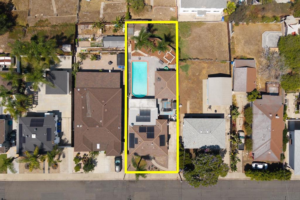 Stunning single story La Mesa pool home w/ a detached ADU! Paid off Solar. This property perfectly combines vintage charm with modern upgrades on a private 7,200 sq. ft. lot. The main home offers 1,250 sq. ft. with 2 bedrooms, 1 bathroom, a spacious family room overlooking the pool, and a cozy living room featuring hardwood floors and a wood-burning fireplace. The updated kitchen includes granite countertops, a pantry, and adjacent laundry room with exterior access. The private resort style backyard includes a sparkling pool, spa, hot tub, and covered outdoor living space, perfect for entertaining. A long gated driveway provides extra parking and storage. The 420 sq. ft. detached ADU offers its own entrance, full bathroom and has high ceilings inside. Additional upgrades include 21 owned solar panels, new plumbing, new HVAC, drought-resistant landscaping, new slider, and new water heater. Conveniently located in a walkable neighborhood near shopping, dining, and more, this home has it all!