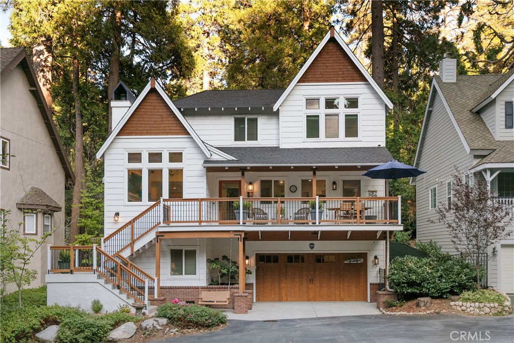 Discover lakeside elegance in this rare Village Cove home—offering private beach access, a 5-minute scenic stroll to Lake Arrowhead Village with charming dining, shops and live entertainment. Enjoy the best of lakeside living in a serene, park-like setting with panoramic forest views and a seasonal creek right outside your door. The open-concept great room features soaring cathedral ceilings, exposed beams, and a cozy stone fireplace, flowing seamlessly to a peaceful patio for effortless indoor-outdoor entertaining. At the heart of the home, the chef’s kitchen now boasts a brand-new professional-grade Wolf stove, along with newly added premium appliances and refined finishes— that make cooking and hosting a joy. The primary bedroom has soaring ceilings, a walk-in bath and an ensuite bathroom. There are two bedrooms with a continental bath. In addition is dedicated office, and a versatile bonus room—ideal for a guest suite or a private gym—this home adapts to your lifestyle. A two-car garage, abundant storage, and thoughtful design throughout ensure it’s as functional as it is luxurious. And with exclusive access to a private beach and lawn, it’s more than a home—it’s your own lakeside getaway.