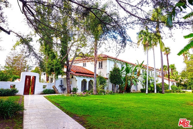 Over an acre of flat land in prime Beverly Hills. The home has been elegantly preserved with the 1920's charm. A former home of several celebrities including Marlene Dietrich. A wonderful home for entertainment with huge outdoor areas. Olympic size pool with pool house for his and hers areas. Plenty of room to expand. 8 bedrooms, 8 baths. 2 bedroom guest house over a 3 car garage and a long driveway with carport and plenty of parking. Pool house has his and hers changing rooms and bathrooms.