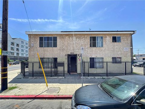 Photo of 1400 W 65th Pl, Los Angeles, CA 90047 (MLS # MB26087048)
