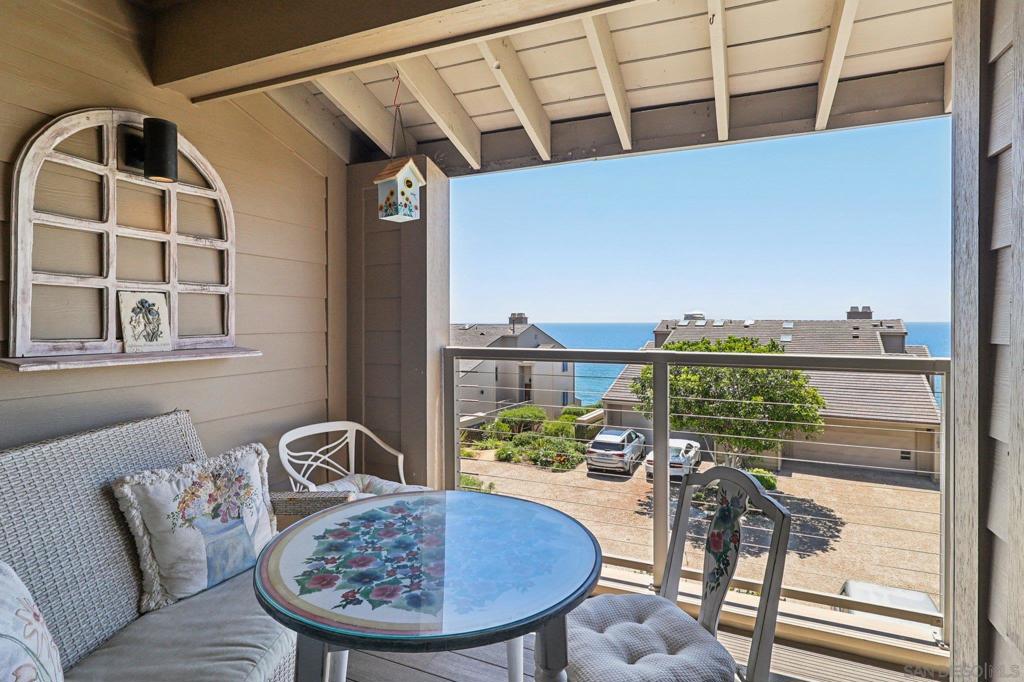Rare Opportunity to own in Del Mar Woods with breathtaking OCEAN VIEWS! This spacious 2 bed + den, 3 full bath home combines coastal charm with endless potential. The upgraded kitchen features stainless steel appliances and an open layout to the living room, perfect for entertaining and enjoying the view. Step out onto your deck and take the private stairs to scenic bluff side trails overlooking the beach. The primary suite is a luxurious retreat with vaulted ceilings, fireplace, ensuite bath, and a private balcony with ocean views. The oversized two car garage provides generous storage and convenience. Enjoy resort-style amenities including a pool, spa, fitness center, tennis courts, and clubhouse... all just moments from top dining, beautiful beaches, Torrey Pines, the Del Mar Racetrack, and more!