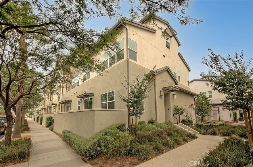 Welcome to 9412 Shade Place, a stylish 2020-built, end unit condo in the highly desirable master-planned community of The Resort in Rancho Cucamonga. With approximately 1,955 sq. ft. of modern living space, this home features 3 spacious bedrooms, 2.5 bathrooms, and a versatile third-story large loft that can easily serve as a bonus room, media space, or home office. Step inside to an open-concept floor plan where natural light flows through the living and dining areas. The gourmet kitchen offers a clean, timeless look with crisp white cabinetry, quartz countertops, stainless steel appliances, and a custom backsplash—designed for both function and style. The seamless flow makes it perfect for everyday living and hosting gatherings. Upstairs, the primary suite is a private retreat with a walk-in closet, dual vanities, and a glass-enclosed shower. Additional two bedrooms are roomy and adaptable, while a convenient upstairs laundry room simplifies daily routines. Modern energy-efficient features include a tankless water heater and a whole-house fan—ideal for cooling the home without always relying on the A/C. The 2-car garage is finished with epoxy flooring, ceiling-mounted storage racks, and extra built-in storage space. Living at The Resort means access to incredible amenities: The Club on 6th features a resort-style pool and spa, fitness center with yoga room, conference spaces, event rooms, complimentary coffee bar, kids’ playroom, fire pits, BBQ grills, and even a dog wash station. Multiple dog parks and monthly community events, like the local farmers market, create a vibrant neighborhood atmosphere. The location is unmatched—just steps from Toyota Arena, minutes to TopGolf, Ontario Mills, Victoria Gardens, and endless shopping and dining options. Commuters will appreciate quick access to major freeways, the Rancho Cucamonga Metrolink, and Ontario International Airport. Combining modern finishes, energy-efficient design, and resort-style amenities, 9412 Shade Place is more than just a home—it’s a lifestyle.