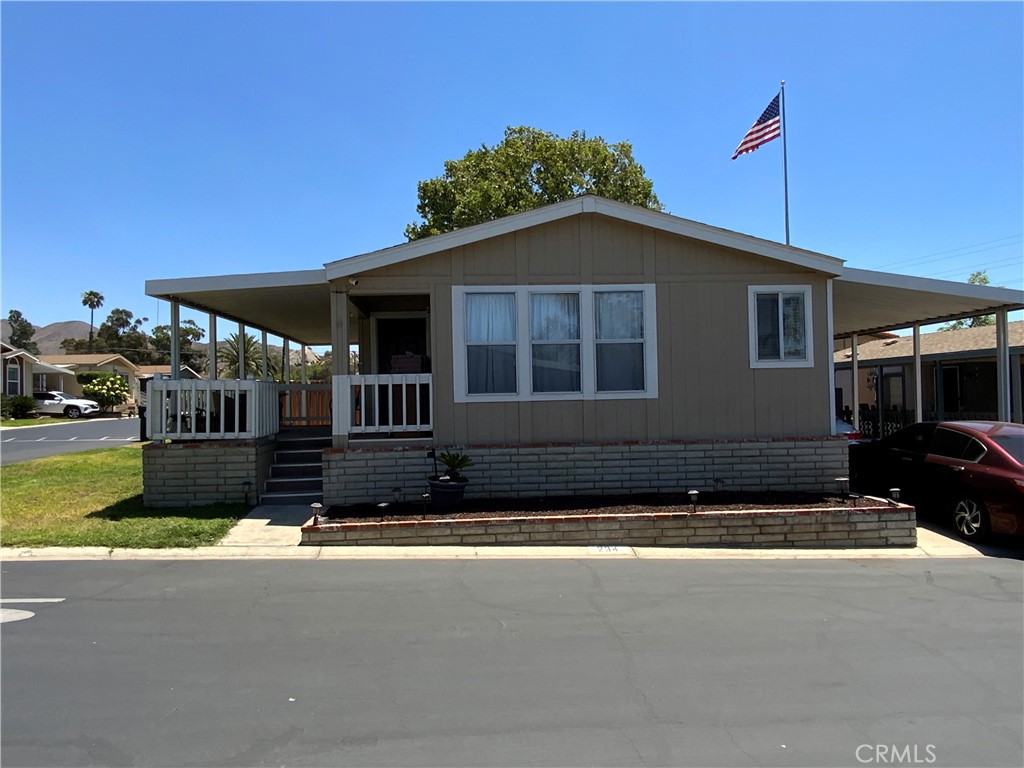 Beautifully Renovated Corner Lot Mobile Home!! Welcome to this gorgeous and spacious corner lot Mobile home, perfectly designed for comfortable living. Step up onto a large, inviting porch and enter into an open-concept living area featuring stylish laminate wood flooring and an abundance of natural light.The open floor plan flows seamlessly into a generous dining area and a stunning kitchen equipped with quartz countertops, elegant self-closing cabinets, and ample storage.This home also offers a versatile bonus room, perfect for use as a third bedroom, home office, or hobby space. The primary bedroom is spacious and relaxing, complete with a luxurious en-suite bathroom featuring a jacuzzi tub—ideal for unwinding after a long day.Outside, you’ll find a convenient storage shed and beautifully kept grounds. The community itself boasts fantastic amenities, including a sparkling swimming pool with scenic views, a clubhouse with pool tables, a relaxing sauna and spa, and more. Centrally located with easy access to the 60 Freeway, this home combines comfort, style, and convenience—all in one place. Don’t miss out—schedule your private showing today!