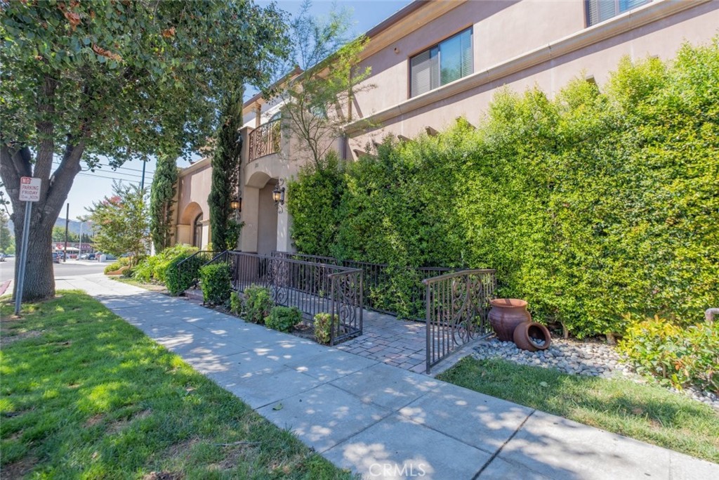 Welcome to Villa Verdugo, a haven nestled in Burbank. This exquisite condo boasts 3 bedrooms and 2 bathrooms, offering a serene abode within a private residential complex, perfectly positioned in the heart of the City of Burbank, in proximity to the bustling studios. Enjoy the convenience of elevator access from the garage and beyond. As you step in, an elegant lobby entrance beckons, leading to a tranquil courtyard that enhances the ambiance. Unit 103, discreetly situated at the rear, shares just one common wall. Inside, discover a luminous and expansive floor plan adorned with the elegance of hardwood flooring, lofty high-ceilings, and crown molding that exudes sophistication. A dedicated laundry area, complete with a stackable washer and dryer, adds to the functional charm. The kitchen is a masterpiece of design, boasting top-of-the-line appliances, sleek countertops, and an artful decorative backsplash that enhances the aesthetic. Throughout the unit, hidden storage spaces and intricate details delight the discerning eye, weaving an enchanting tapestry of refinement. The bedrooms bask in natural light, generously sized to create inviting retreats. The primary bedroom enjoys the luxury of an en-suite bathroom, ensuring a private sanctuary. Ample street parking awaits your guests, while the convenience of trendy restaurants and shops lies just moments away. With meticulous details interwoven throughout each corner of these units, prepare to be captivated and find yourself falling in love with the essence of Villa Verdugo.