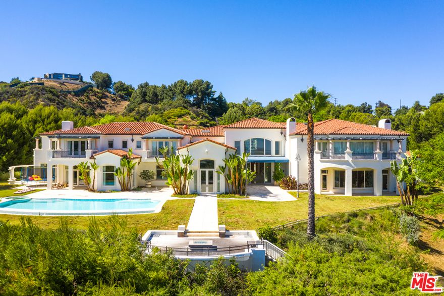 Perched atop Beverly Park and sitting on 4.67 acres is the ultimate two-home compound. The combined properties of 73 & 74 are accessed from a single, gated driveway at 74 and may be separated with the addition of a second entrance. With its commanding city & ocean views and impeccable layout & framework, the main residence of 73 can easily be one of the most incredible properties in LA with some amenity upgrades. The two-story main residence features 26,000 SqFt and affords its guests 14 bedrooms & 22 bathrooms. The expansive master suite is roughly 4,000 SqFT and includes luxurious appointments such as dual bathrooms, custom wardrobes & a sweeping balcony with picturesque views. The butlers kitchen & commercial kitchen with walk-in fridge & freezer allow for large gatherings in the gargantuan 35-person dining room. 74 BP is apx 14,000 SF with an addl 3,000 of staff quarters and parking.  With the right remodel this estate would be the crown jewel of Beverly Park, if not Los Angeles.