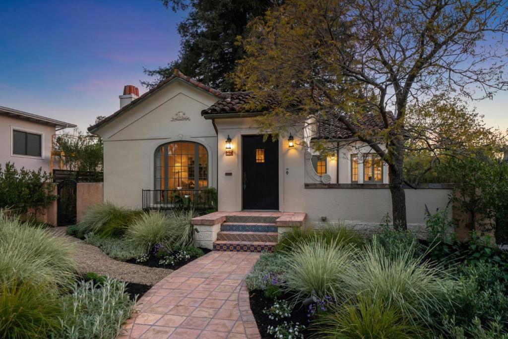 Refined sophistication and modern luxury converge in this masterfully updated 1920s Spanish-style residence in the heart of downtown Menlo Park. This exclusive property offers a rare opportunity to enjoy the best of Peninsula living with privacy, elegance, and walkability. The main level features 3 beds, 2 impeccably remodeled baths, a formal living room with period details, and an open-concept kitchen and dining area anchored by a large center island ideal for everyday living and entertaining. A fully independent lower-level studio suite, with its private entrance and own kitchen, bath and laundry, is perfectly suited for guests, live-in staff, or multigenerational living. Curated finishes include hardwood floors, bespoke lighting, and interiors that blend classic character with modern refinement. Outside, the home is framed by a private rear yard with fire pit, Redwood grove, outdoor kitchen and al fresco dining terrace - perfect for gatherings or quiet retreat. A gated driveway leads to a detached two-car garage with potential use for parking, a gym, office, or future ADU. Located in the prestigious Menlo Park school district and minutes from Stanford, downtown Palo Alto, Sand Hill Rd & top tech campuses, this is a distinguished downtown sanctuary of elegance and lifestyle.