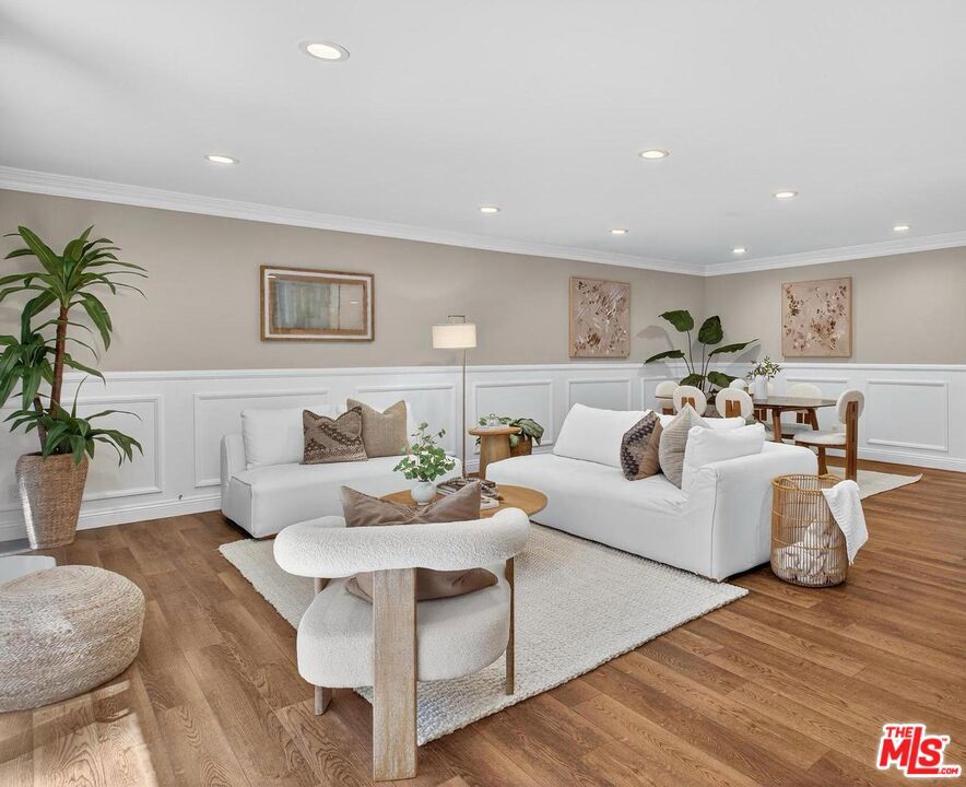 Welcome to this beautifully updated 3-bedroom, 2.5-bath townhome in the heart of Sherman Oaks. The main level features a bright, open living and dining area complete with a cozy fireplace and private patio. The first floor also offers a recently renovated powder bath, convenient in-unit laundry and a spacious kitchen. Upstairs, all three bedrooms are thoughtfully tucked away from the entertainment spaces. The primary suite offers soaring ceilings, two walk in closets and a brand-new en-suite bath. This home enjoys one of the best locations in the complex quietly situated furthest from the street and just steps from the pool, rec room, and expansive community yard. It is also conveniently located very near to the assigned parking spaces in the secure gated garage. With its ideal layout, updated finishes, and convenient location, this townhome is the perfect opportunity to enjoy the vibrant lifestyle Sherman Oaks has to offer.