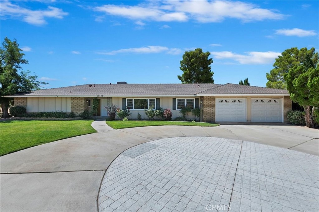 LOCATION, LOCATION, LOCATION!!! Welcome To Your Forever Home! This Oasis in the Desert is located on a view lot in the heart of Apple Valley! A MUST-SEE PROPERTY!!!
This impressive property is accessed via a lengthy private driveway that leads to an expansive area of decorative flatwork, providing an elegant entrance to the residence.
Step inside to discover a spacious interior designed for both comfort and entertainment. The locations of the newer windows frame stunning views of the landscape and the valley, while the open living spaces create an inviting atmosphere. The kitchen boasts of more modern appliances, abundant cabinetry, and generous countertops, perfect for gatherings. Retreat to the primary suite, where you'll find a luxurious bathroom with walk in shower, double sinks, and ample closet space. The backyard offers a tranquil escape with professionally landscaped grounds, a fully finished covered patio, room for outdoor activities, and so much more—all set against the breathtaking backdrop of Apple Valley's amazing views. This Apple Valley gem promises a unique blend of comfort, beauty, and a lifestyle to be cherished for years to come. It won't last long... Make your appointment today!