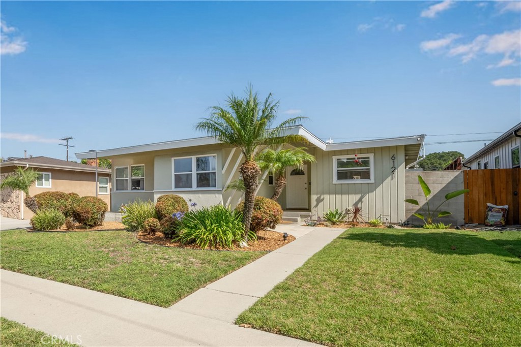 This classic mid-century Plaza home offers an abundance of character combined with the best of modern conveniences. In addition to the wonderful 1950's architecture, added features include: refinished original oak hardwood flooring, original brick fireplace, central heat and AC, recently remodeled bathrooms and large separate laundry room, complete with folding counter and storage. This floorplan is light and bright, with an abundance of windows running along the living and dining spaces. The private backyard has a generous covered porch, large grass area and block walls surrounding. The parking is expansive, with a long driveway and a two car detached garage. Wonderful local schools are available, including Patrick Henry Elementary, Burcham Elementary and Marshall Academy Of The Arts, which are just a short walk away. The capture of this street cannot be overstated. It is not a pass through street, and it is located right in the middle of the neighborhood with well kept homes around it. Hurry, book your showing today.