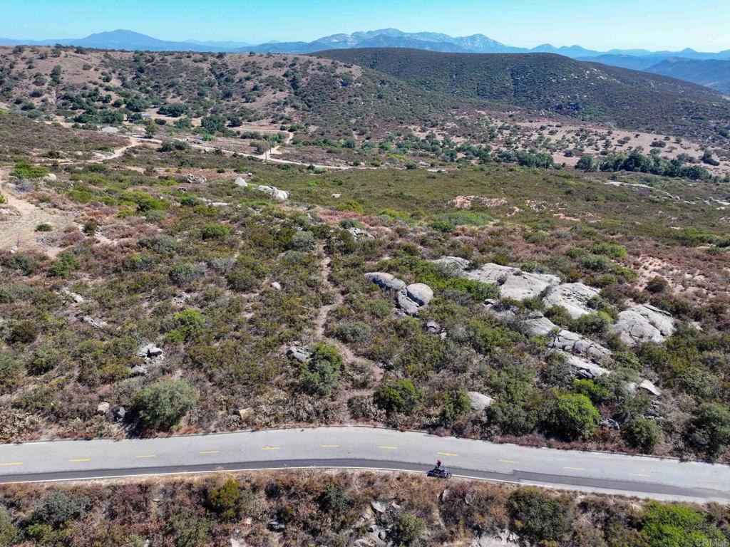 Big Views, Big Dreams! Prime 8+ acre lot perched along the ridgeline with breathtaking 270-degree panoramic views! Off paved road.This one-of-a-kind property offers several usable acres—perfect for your dream home, a vineyard, or a peaceful retreat. Come experience the best of Ramona’s natural beauty with endless skies, stunning sunsets, and room to roam. Land like this doesn’t come around often—come walk it and fall in love!