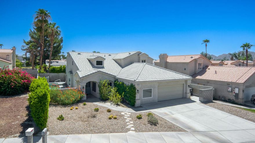 Located in a highly desirable Primrose neighborhood with no HOA.  This beautiful family home has 4 bedrooms and 3 full bathrooms with a private in-ground saltwater pool and spa and front yard desert landscaping. Enter through double doors into a formal entry with a wood featured wall and an open floor plan offering a formal living room with vaulted ceilings, formal dining area, gourmet kitchen with granite slab counters and stainless steel appliances. There's breakfast bar seating opening into a large family room with a fireplace and built-in wet bar with granite counter, 2 built-in desk areas, a bedroom with ensuite bathroom and a laundry room that completes the main floor.  Upstairs you will find 3 more bedrooms including a massive primary suite with fireplace, a walk-in shower, soaking tub, and His and Hers walk-in closets and a wrap-around balcony with panoramic mountain views. There are 2 more bedrooms that also access the balcony and there is a full size hall bathroom for the secondary bedrooms to share.  This home also features plantation shutters throughout, french doors, ceiling fans, dual A/C, Wainscoting, recessed lighting, an attached 2-car garage with electric car plug-in, and a bonus room in the garage. The private back yard has a gated saltwater pool and spa, side yard with covered patio, artificial turf and cement area -- this is a perfect space for entertaining. Schedule your private tour today. Mortgage savings may be available for buyers of this listing.