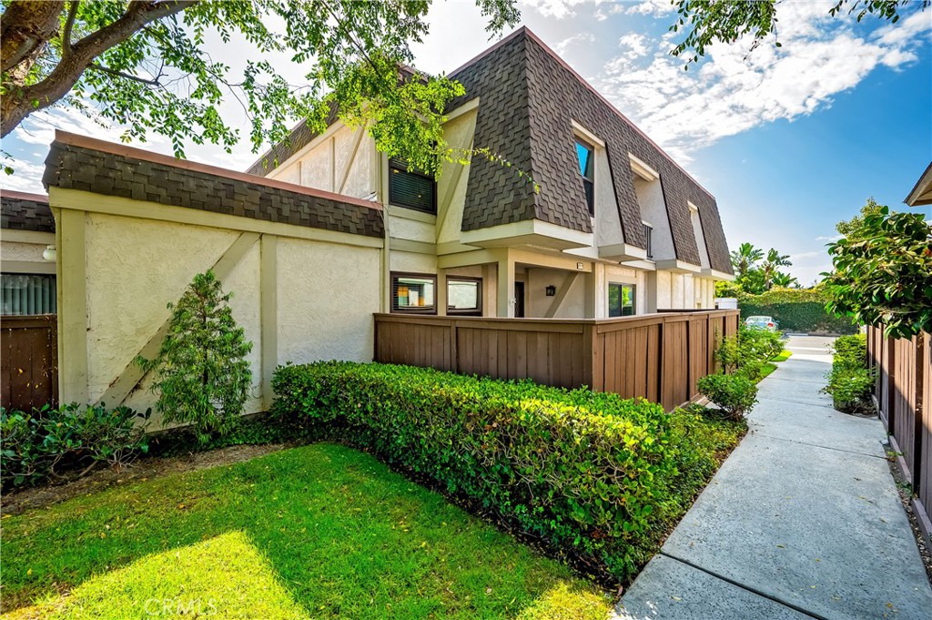 Welcome home to your updated 2-bedroom, 2.5-bath townhome offering 1,268 sq. ft. of comfortable living in the Influential Townhomes community. From the moment you step inside, pride of ownership shines through every detail. The open-concept main level features a remodeled peninsula-style kitchen with crisp white shaker cabinets, quartz countertops, and a dining area just steps away—perfect for everyday living or entertaining. Luxury vinyl plank flooring flows throughout the home, complemented by fresh interior paint, dual-pane windows, and a cozy gas fireplace in the living room. Upstairs, the spacious primary suite offers a private balcony retreat and office nook , while the second bedroom boasts a walk-in closet and its own en-suite bathroom, ideal for guests or family. Additional highlights include updated bathrooms, a convenient indoor laundry room, an attached one-car garage, and an assigned carport space. Enjoy the outdoors with a private enclosed patio/porch area for relaxing or entertaining. Residents of Influential Townhomes enjoy resort-style amenities including a sparkling pool, spa, clubhouse, and BBQ area. Located in Cypress, this home is part of a top-rated school district with access to the prestigious Oxford Academy (entrance exam required), and just minutes from shopping, dining, parks, and major freeways. Don’t miss this move-in ready opportunity in one of Cypress’s most desirable communities!