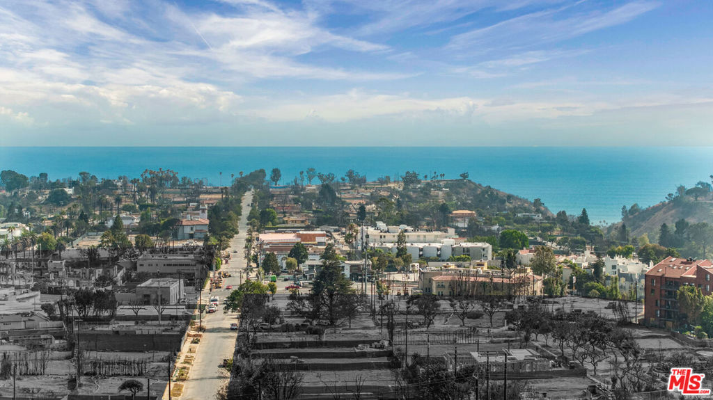Perched above the Alphabet Streets with sweeping Pacific Ocean and Santa Monica Mountain vistas, this 5,006 SF parcel offers an exceptional canvas for a custom coastal residence. Prior to the recent wildfire, the site held a 1,272 SF single-level home built in 1950; today, it stands cleared, with final debris removal certification in place -- ready for vision and execution. Elevated and private, the lot captures both dramatic views and an intimate neighborhood setting, just minutes from Palisades Village. With effortless access to Sunset Boulevard and PCH, this is a rare opportunity to create a dream home while contributing to the revitalization of one of the Westside's most beloved coastal enclaves.