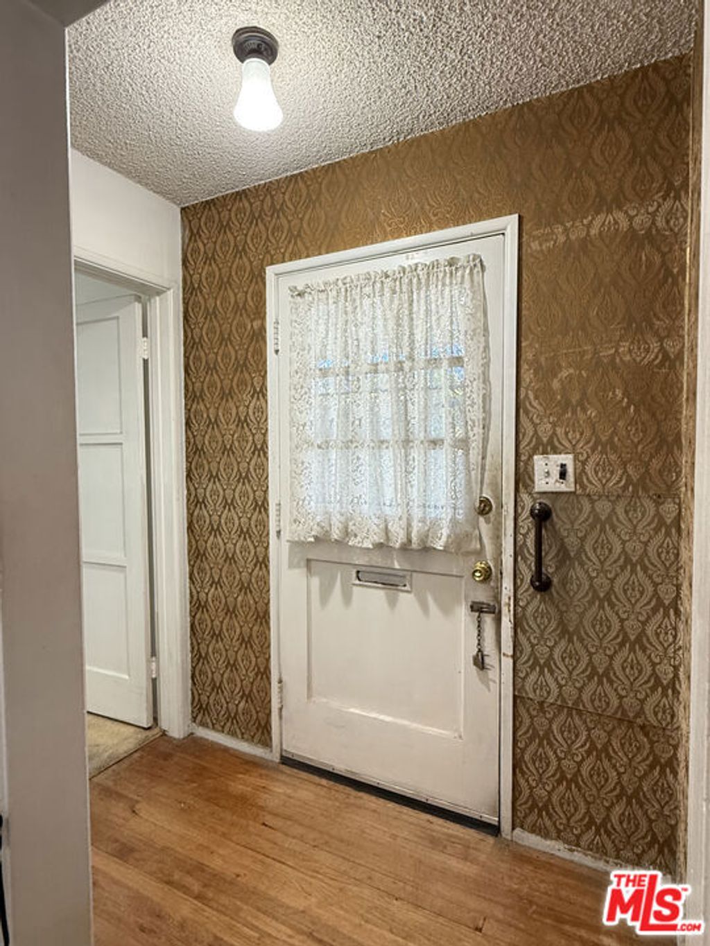 Photo of 3810 S Dunsmuir Avenue, Los Angeles, CA 90008 (MLS # 25615149)