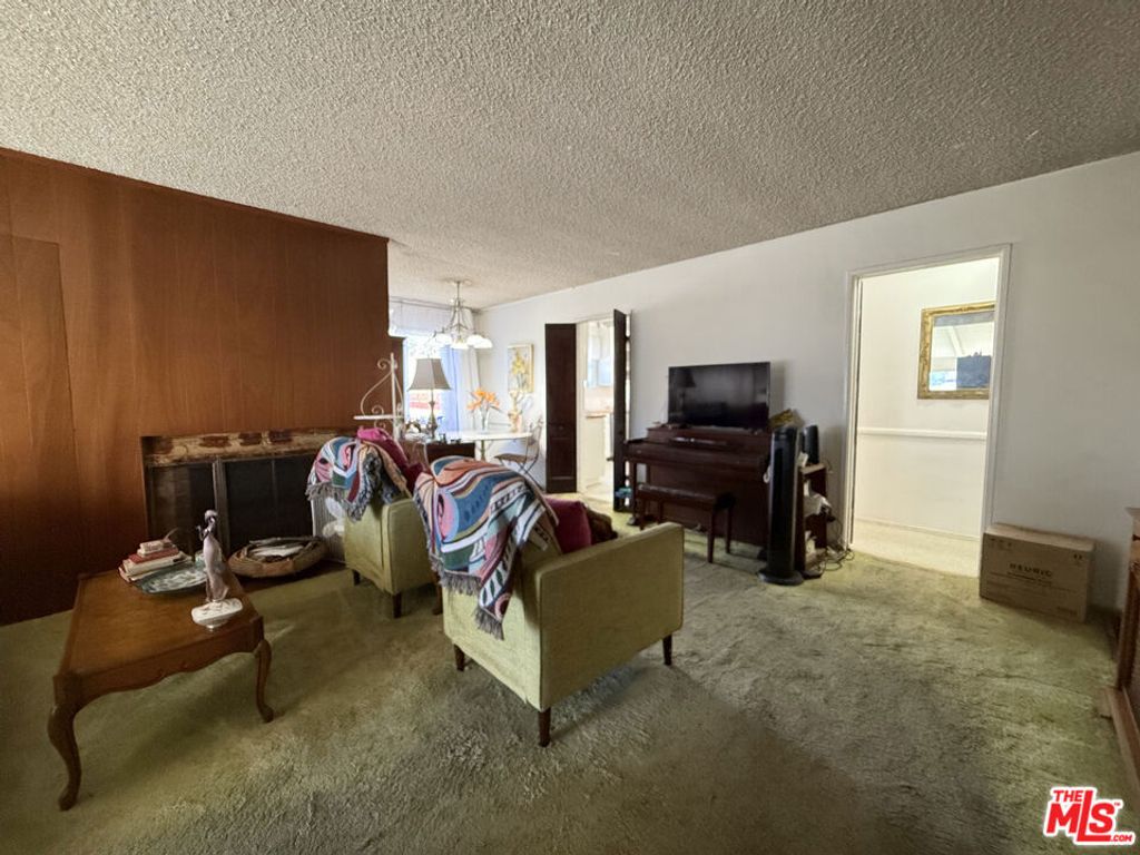Photo of 3810 S Dunsmuir Avenue, Los Angeles, CA 90008 (MLS # 25615149)