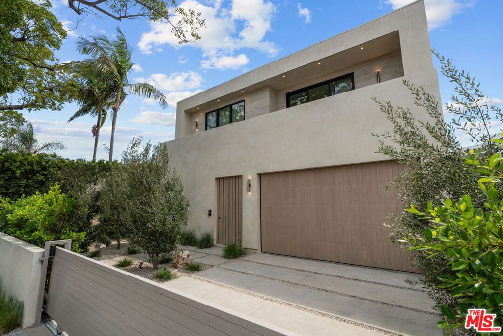 Welcome to this brand-new construction, a modern masterpiece located in one of Los Angeles' most sought-after neighborhoods. This stunning 5-bedroom, 5-bathroom home offers an open-concept floor plan with soaring ceilings, high-quality finishes, and seamless indoor-outdoor living. The gourmet kitchen is equipped with top-of-the-line Miele appliances, custom cabinetry, and a spacious island perfect for both cooking and entertaining. Pocket sliding doors open to the private outdoor space, perfect for hosting and enjoying the California lifestyle.The luxurious primary suite features a spa-inspired bathroom and walk-in closet, while each additional bedroom includes its own en-suite bath. With elegant fixtures, custom finishes, and a balance of style and comfort, this home is designed for modern living.Located in the heart of Beverly Grove, this home places you within minutes of premier dining, shopping, and entertainment, while still offering the tranquility of a residential street. A true blend of luxury, style, and location this home is not to be missed.