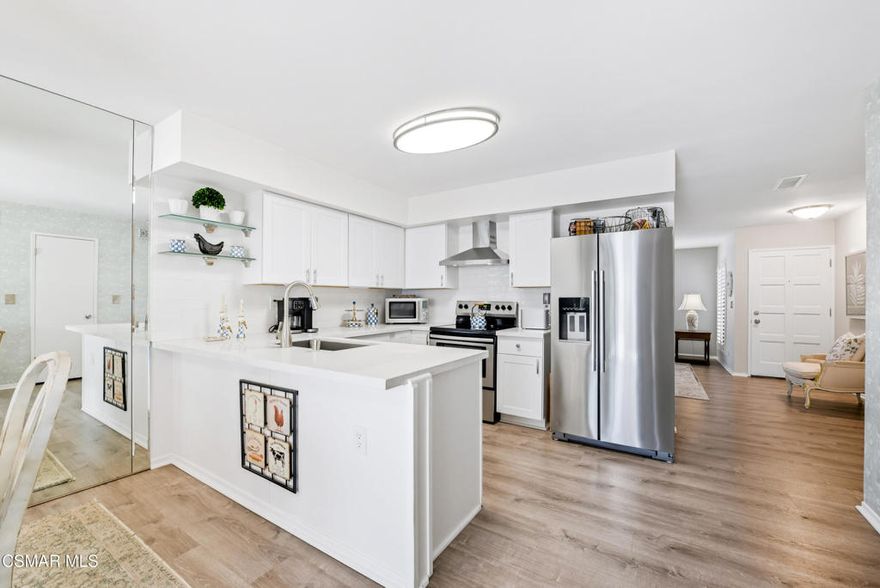 Tucked into the highly desirable Northshore community of Westlake Village, this updated single-story two-bedroom, two-bathroom home offers effortless living and an unbeatable lifestyle. The refreshed kitchen features white shaker cabinetry, quartz countertops, and opens directly to the dining area with sliding door access to a private patio--perfect for outdoor seating, entertaining, and easy garage access. Inside, the living room is anchored by a cozy fireplace, while both bathrooms have been thoughtfully updated. Plantation shutters throughout, an updated HVAC system, newer roof, and epoxied garage floors add comfort, style, and peace of mind. Beyond the home, Northshore residents enjoy lake access, a private beach, community docks, and beautifully maintained greenbelts--creating a resort-like setting just minutes from shopping, dining, and everyday conveniences in Westlake Village.