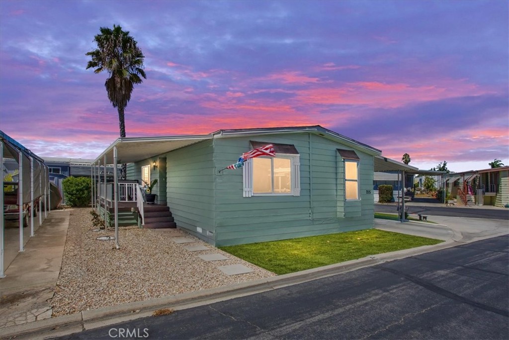 A well appointed recently renovated mobile home is located in a vibrant 55 plus upscale community complete with a fishing lake and so much more! This spacious TURN KEY AND WELL MAINTAINED home features new windows throughout, new water heater, new duct work, new exterior/interior paint. The peaceful front patio, featuring a new front door, is ideal for relaxing and enjoying a bbq with family and friends. The home also boasts an upgraded kitchen with quartz counter tops, designer backsplash, new oven/stove, and new high end laminate flooring throughout. The primary bathroom has been upgraded as well with a new walk-in shower, vanity, and countertops. New carpet has been installed in both bedrooms. This comfortable home also includes a workshop/ tool shed for handy man projects Moreover, the roof was replaced a few years ago. The home is strategically located on a large corner lot with gorgeous mountain views! Big box retail and well known restaurants are near by.
