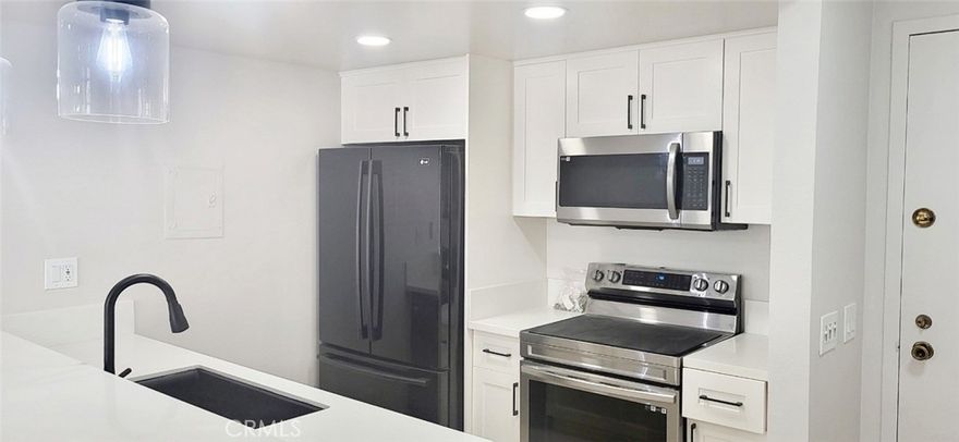 Enjoy the modern living experience in Hollywood Hills (Los Angeles). Attached condominium, top floor, renovated unit in the prestigious Briarwood community. 1 bedroom/1 bathroom unit boasts natural light, open floor plan and stylish upgrades. A cozy fireplace in the living room with a balcony that overlooks the pool with city views and the Palos Verdes Peninsula. Remodeled Kitchen (that opens to the living room) with stone counter tops, a breakfast bar, new appliances and new flooring. Stylish bathroom with dual sink vanity and a walk-in shower. Large walk-in closet in the bedroom, Central HVAC system, added conveniences include - 2 parking spaces, inclusive utilities except electricity, on site management. Located on Camino Palmero Street, this condo is short stroll from scenic Runyon Canyon. Steps away from attractions like Hollywood Walk of Fame. Theaters, Shopping Centers.