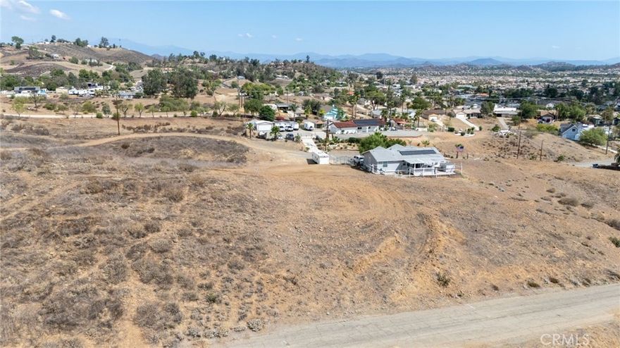 Just 25 minutes from Riverside, this .19-acre lot in Quail Valley sits at the top of the street at its highest point, offering incredible panoramic views of the valley below and the surrounding mountains. The property has paved road access, making it ideal for a future build or long-term investment. It’s a quiet setting in a growth corridor, with scenery that makes this parcel stand out.
