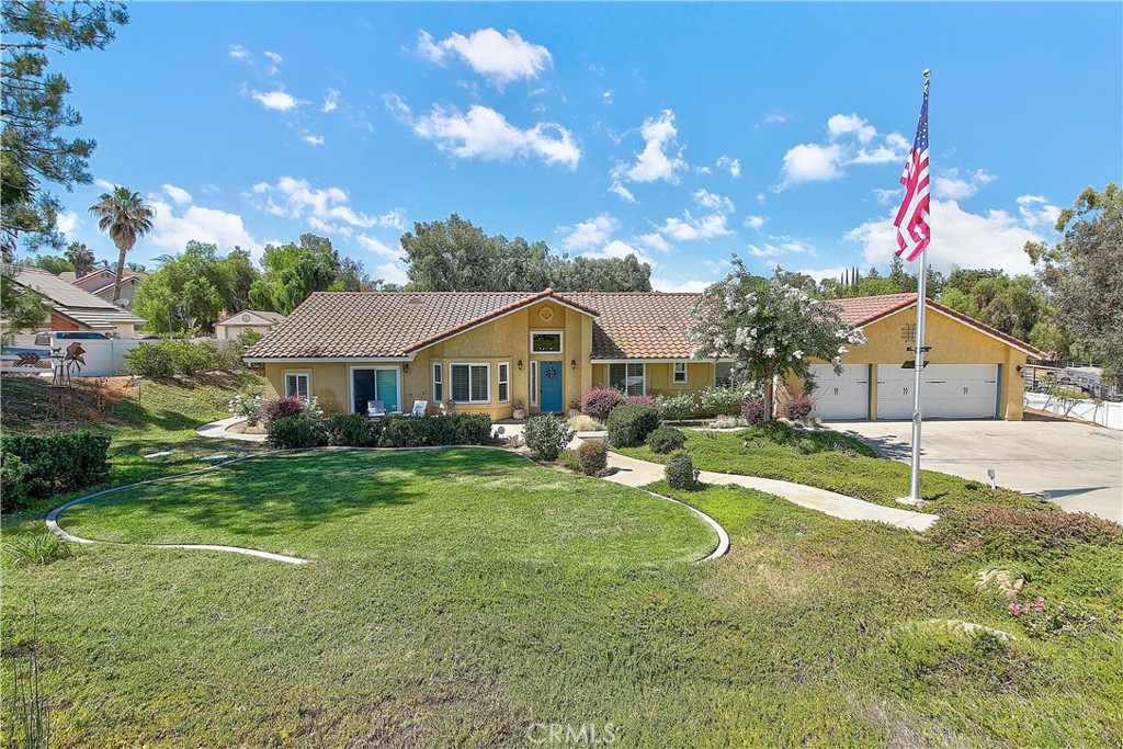 Welcome to this dream ranch-style property nestled in the heart of Riverside (Mockingbird Canyon), offering the perfect blend of rural charm and city convenience. This spacious single-story home spans approximately 2,340 square feet and features a thoughtfully designed layout, including a generous primary suite complete with a walk-in closet, dual sinks, a separate soaking tub, and a walk-in shower. An impressive bonus is the attached mother-in-law quarters, currently used as a game room, which includes a large bedroom, private office, full bathroom with walk-in shower, and its own walk-in closet—ideal for guests, extended family, or a home business setup that is fully permitted.
Two additional bedrooms share a full bathroom, and the remodeled kitchen shines with abundant cabinet space, granite countertops, and modern appliances. Open floor plan with high ceilings, recessed lighting, ceiling fans throughout. Laminate vinyl flooring and carpet in the bedrooms, plantation shutters throughout. A dedicated indoor laundry room and a spacious 3-car garage add to the home’s functionality.
The crown jewel of this property is the expansive, over one-acre lot, offering endless possibilities—RV access, drive through long private driveway, potential for additional structures, horse facilities, or whatever your imagination desires. Outdoor features include a unique goat pen with a charming saloon-style façade that cleverly conceals two large storage units, a goat coop, separate dog enclosures, a dog washing station, and an enormous concrete patio with an Alumawood-covered area including 2 ceiling fans that is perfect for entertaining. Enjoy quiet, rural living with all the conveniences nearby—this is a truly rare find in Riverside. LOW taxes & NO HOA.