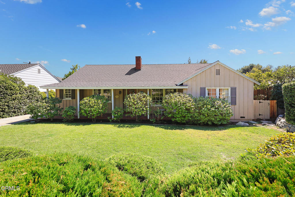 Nestled down a quiet lane in the heart of La Canada Flintridge, this charming home rests quietly, waiting for its next stewards. Owned by the same Family for over 50 years, the property presents a unique opportunity to live near top rated schools, Memorial Park and Town Center. Welcoming you with long covered porch, this classic 1949 ranch home rests behind a peaceful garden and lawn with a driveway leading to a detached garage at the back of the lot. A thoughtful floorplan opens with an entry that leads to the living room with fireplace and large windows that fill the room with soft north light. The space opens to the dining room with the kitchen through a door beyond. An ample size room, the kitchen is comprised with a wrapping counter, a breakfast nook and access to the guest bathroom and mudroom with side door to the driveway. A flex room steps down from the living room and makes a great space for crafts, homework and reading with sun filled windows and door to the backyard. One guest bedroom is located from the entry and provides access to the mudroom and guest bath as well. Down a hall, a second guest bedroom and primary bedroom share a full bath between. The private backyard is set around a refreshing pool with concrete deck, shady lawn and trees around. The simple access from the backyard to the garage leaves opportunity to the imagination. Welcoming the creative spirit, this home provides an opportunity to design your spaces and set your roots in one of LA's most coveted neighborhoods being blocks from La Canada Elementary School.
